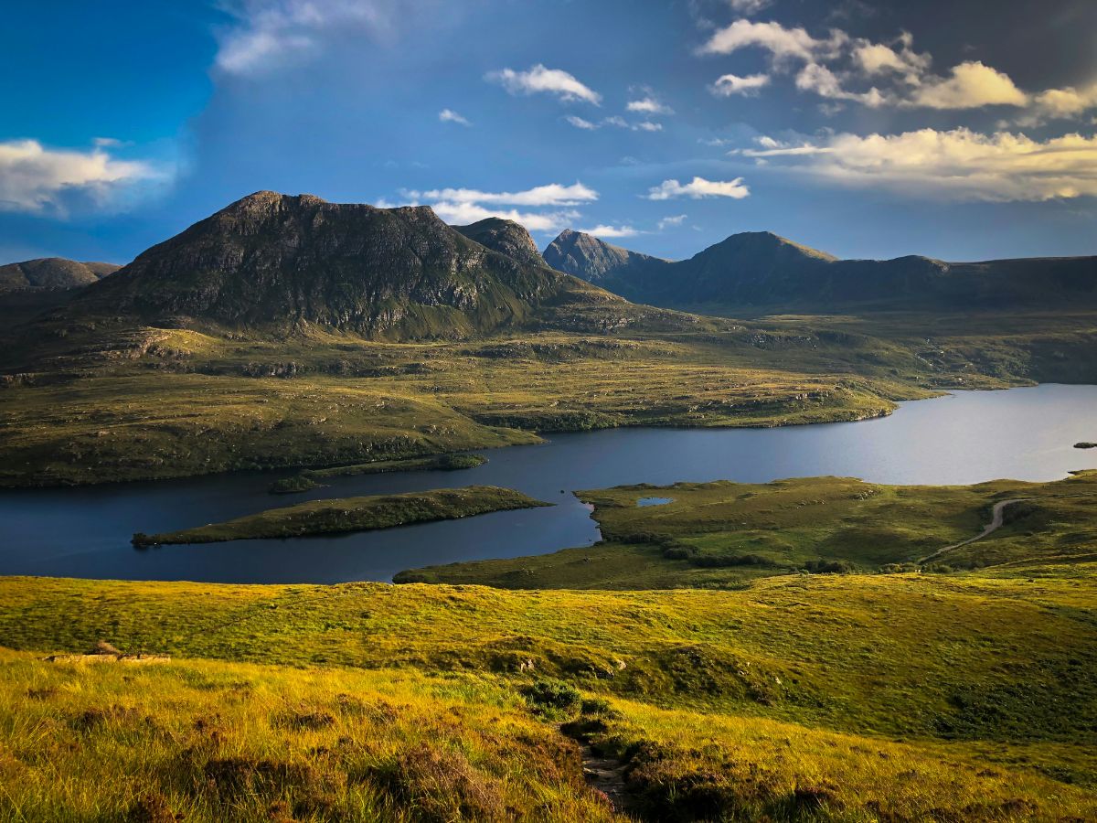 Panoramic view of mountains and loch in Scottish Highlands